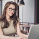 Admissions lady smiling at computer