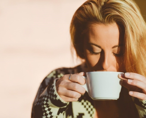 Woman Sipping Coffee