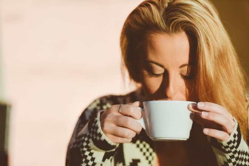 Woman Sipping Coffee