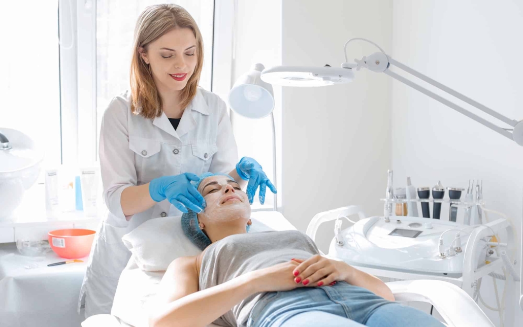Cosmetologist with client