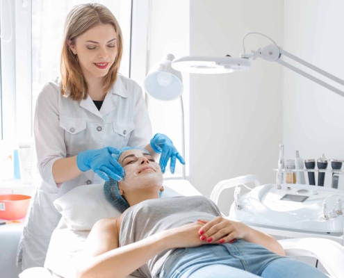 Cosmetologist with client