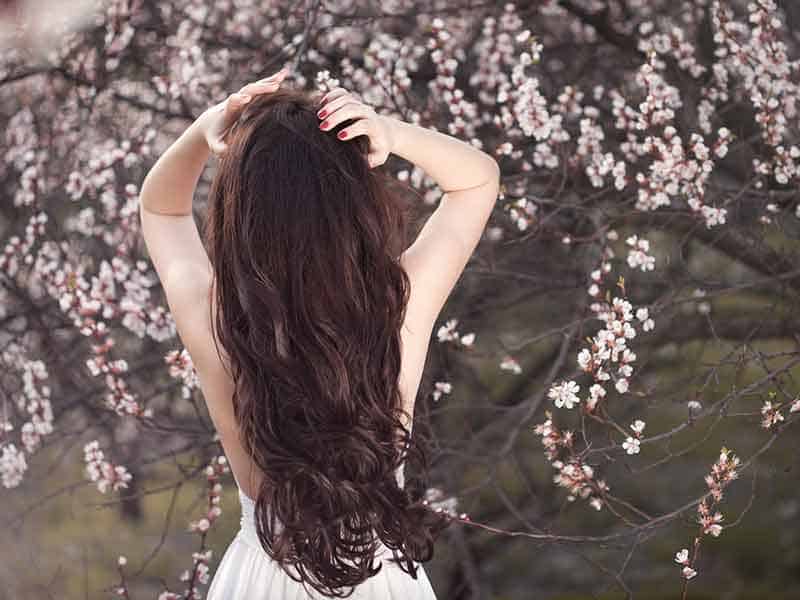 girl with long pretty hair in the spring