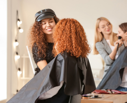 Young Woman With Model In Makeup School