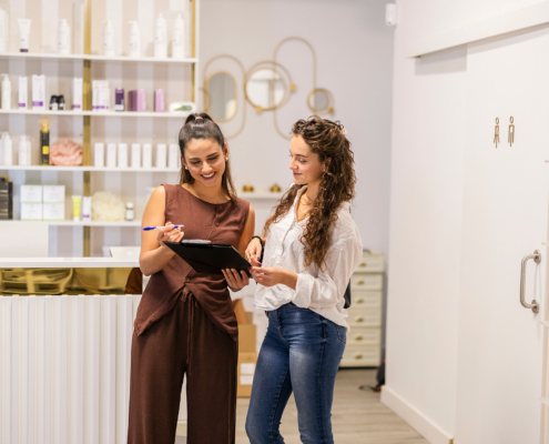 Two Women Discussing Business In A Beauty Salon
